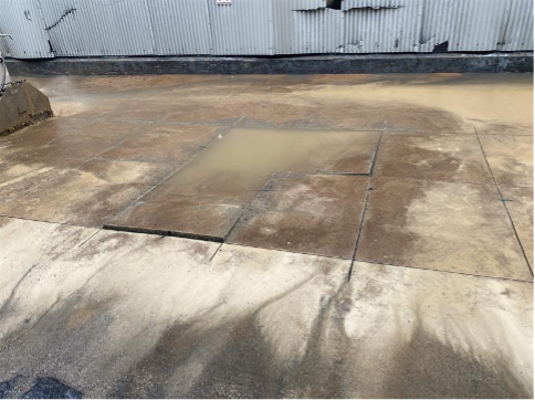 Concrete slab sinks into the ground once saw cutting occurs due to an 8” ductile iron water line with a full circular break.